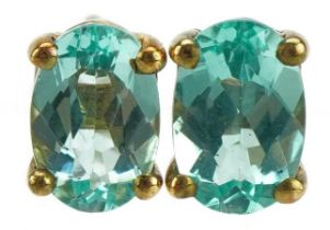 Pair of 9ct gold blue stone solitaire stud earrings, 6mm high, 0.8g