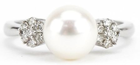 9ct white gold cultured pearl ring with diamond set flower head shoulders, total diamond weight
