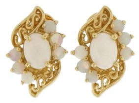 Pair of 14ct gold cabochon opal stud earrings with pierced setting and clip backs, 2.1cm high, 6.9g