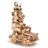 9ct gold and enamel comical pig driving a car charm, 2.8cm high, 10.0g