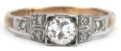 Art Deco 18ct gold and platinum diamond ring with stepped shoulders, the central diamond