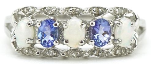 9ct white gold tanzanite, opal and diamond ring with pierced setting, size R/S, 2.5g