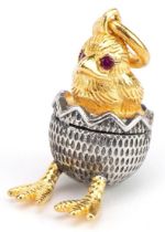 Silver gilt hatching chick pendant with ruby eyes, impressed Russian marks to the suspension loop,