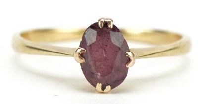 Unmarked gold almandine garnet solitaire ring, tests as 9ct gold, the garnet approximately 7.0mm x