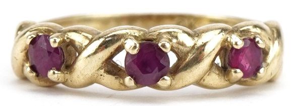 9ct gold ruby three stone ring with pierced setting, size N, 2.3g