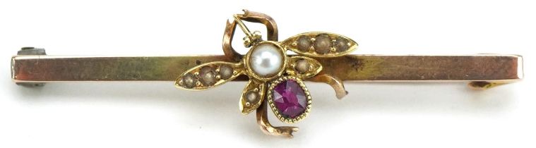 Unmarked gold ruby and pearl fly bar brooch, tests as 9ct gold, 4cm wide, 3.0g