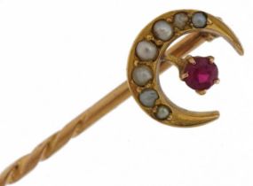 Victorian unmarked gold ruby and seed pearl moon crest stickpin, tests as 15ct gold, housed in a