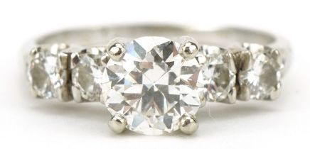 White gold diamond five stone ring, indistinct marks, possibly 14k, the central diamond