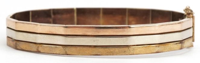 9ct three tone gold hinged bangle, 6.5cm wide, 13.6g