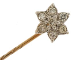 Unmarked yellow and white gold diamond flower head stickpin, tests as 9ct gold, housed in a Fowler &