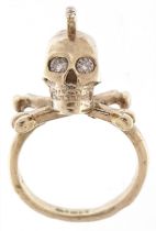 9ct white gold diamond Mohawk skull and crossbones ring, the largest diamonds each approximately 2.