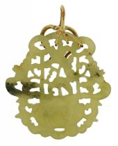 Chinese green jade pendant with unmarked gold mount carved with flowers in a vase, tests as 14ct