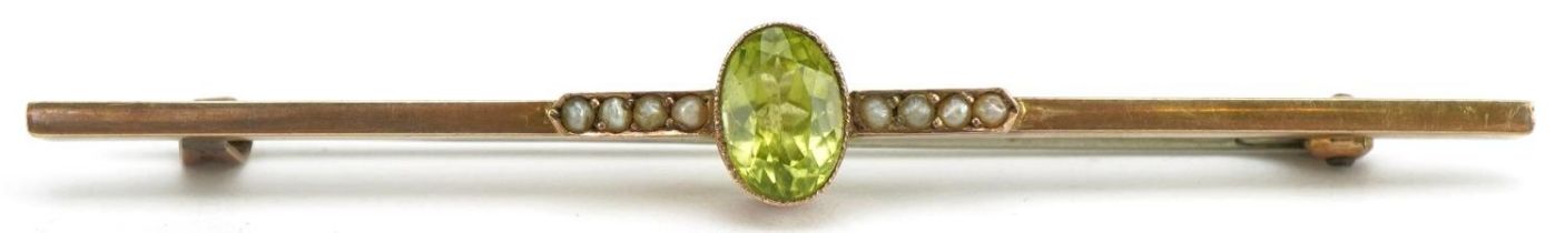 Unmarked gold peridot and seed pearl bar brooch, tests as 9ct gold, 6cm wide, 1.8g