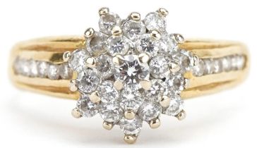 18ct gold diamond three tier cluster ring with diamond set shoulders, the central diamond