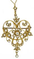Edwardian 15ct gold diamond and seed pearl openwork floral brooch pendant on a 9ct gold necklace,