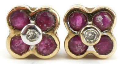 Pair of unmarked gold diamond and ruby flower head stud earrings, 5.5mm in diameter, 1.2g