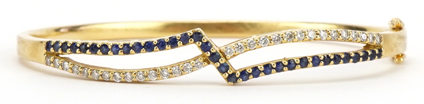 Gems Gallery, 18ct gold diamond and sapphire crossover hinged bangle with box, each stone