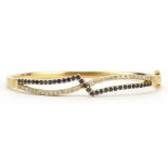 Gems Gallery, 18ct gold diamond and sapphire crossover hinged bangle with box, each stone