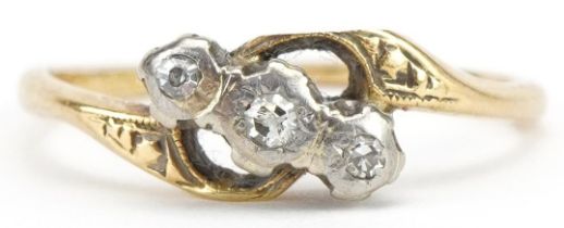 18ct gold and platinum diamond three stone crossover ring, size M, 2.0g