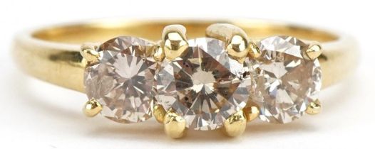 Unmarked gold diamond three stone ring, tests as 18ct gold, total diamond weight approximately 1.