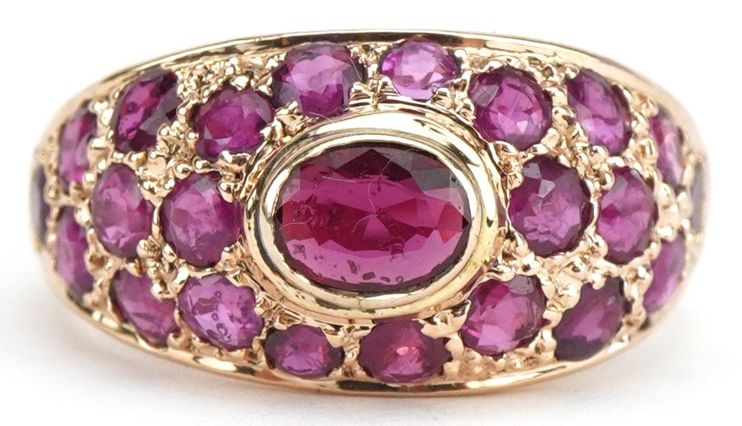 14ct gold ruby ring set with twenty three rubies, size M/N, 4.1g
