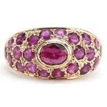 14ct gold ruby ring set with twenty three rubies, size M/N, 4.1g