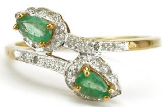 9ct gold emerald and diamond crossover ring, size O, 2.2g