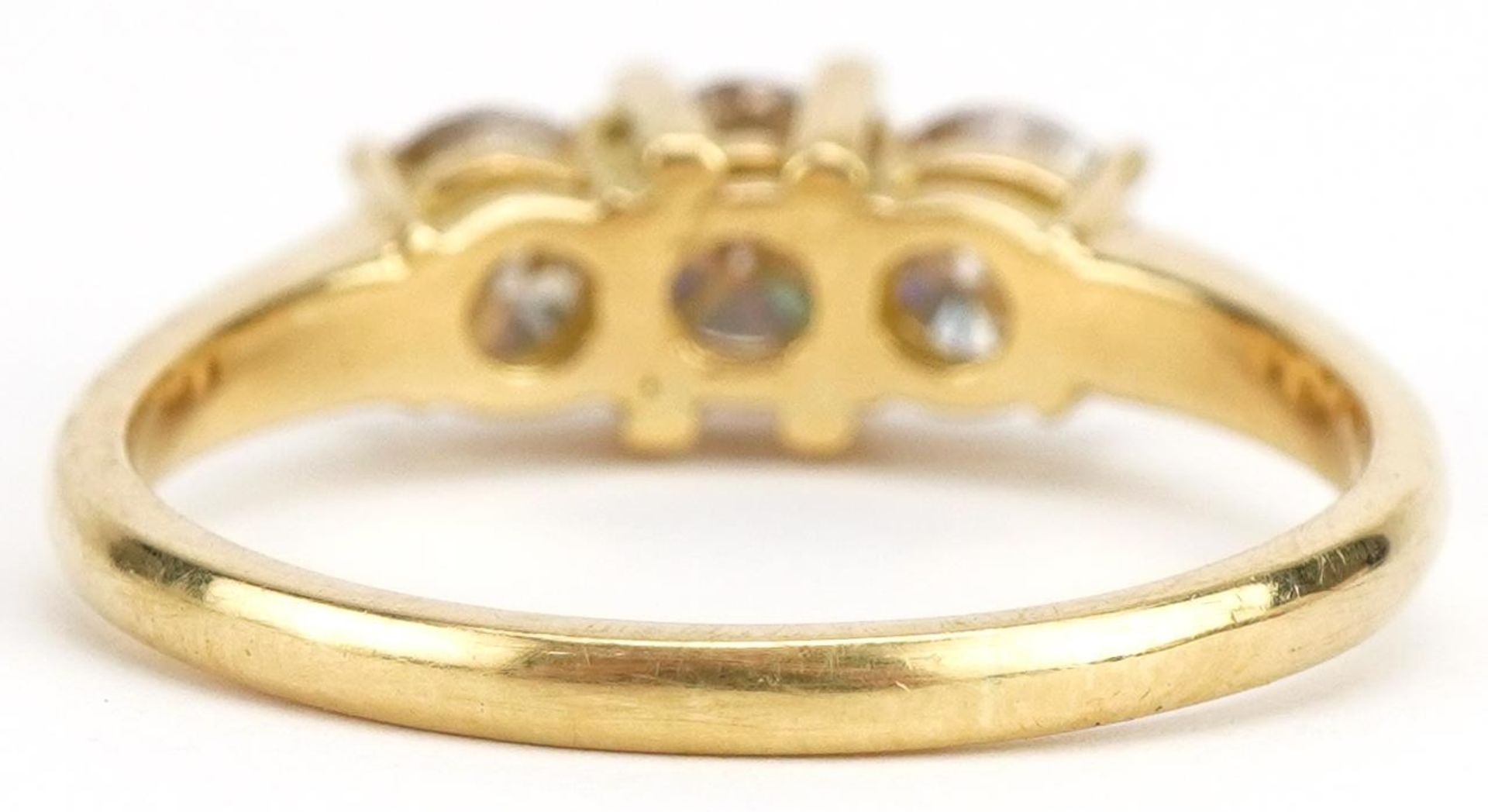 Unmarked gold diamond three stone ring, tests as 18ct gold, total diamond weight approximately 1. - Image 2 of 3
