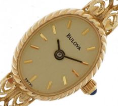 Bulova, ladies 14ct gold Bulova wristwatch with 14ct gold strap and cabochon blue stone crown,