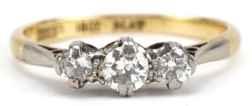 18ct gold and platinum diamond three stone ring, the central diamond approximately 4.0mm in