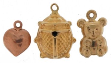 Three unmarked gold charms comprising beetle, teddy bear and love heart, all test as 9ct gold, the