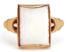 9ct gold opal ring with stepped shoulders, the opal approximately 11.0mm x 9.0mm x 1.68mm deep,