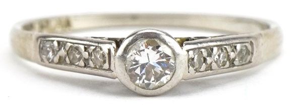 18ct white gold and platinum diamond solitaire ring, with diamond set shoulders, the central diamond