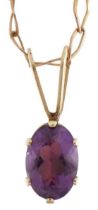 14ct gold amethyst pendant on a 9ct gold necklace, 1.2cm high and 44cm in length, 1.1g