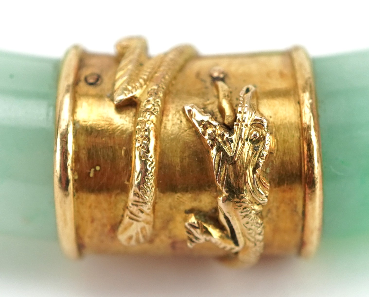 Chinese green jade bangle with unmarked gold mounts decorated in relief with dragons, 9.5cm in - Image 3 of 5