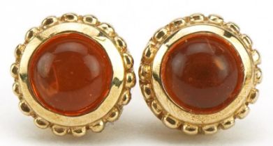 Pair of 9ct gold orange stone stud earrings, possibly Mexican fire opal, 7.4mm in diameter, 1.6g