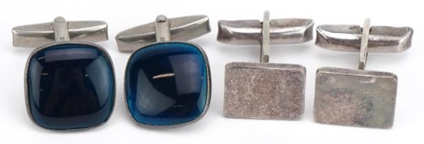 Two pairs of silver cufflinks including a pair with blue enamel, the largest 1.6cm wide, total 22.3g