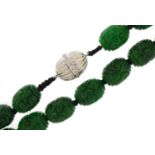 Chinese carved green jade bead necklace with 14ct white gold diamond set clasp, each bead 13.5mm x