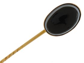 Unmarked gold cabochon Scottish agate stickpin, tests as 9ct gold, housed in a Victorian velvet