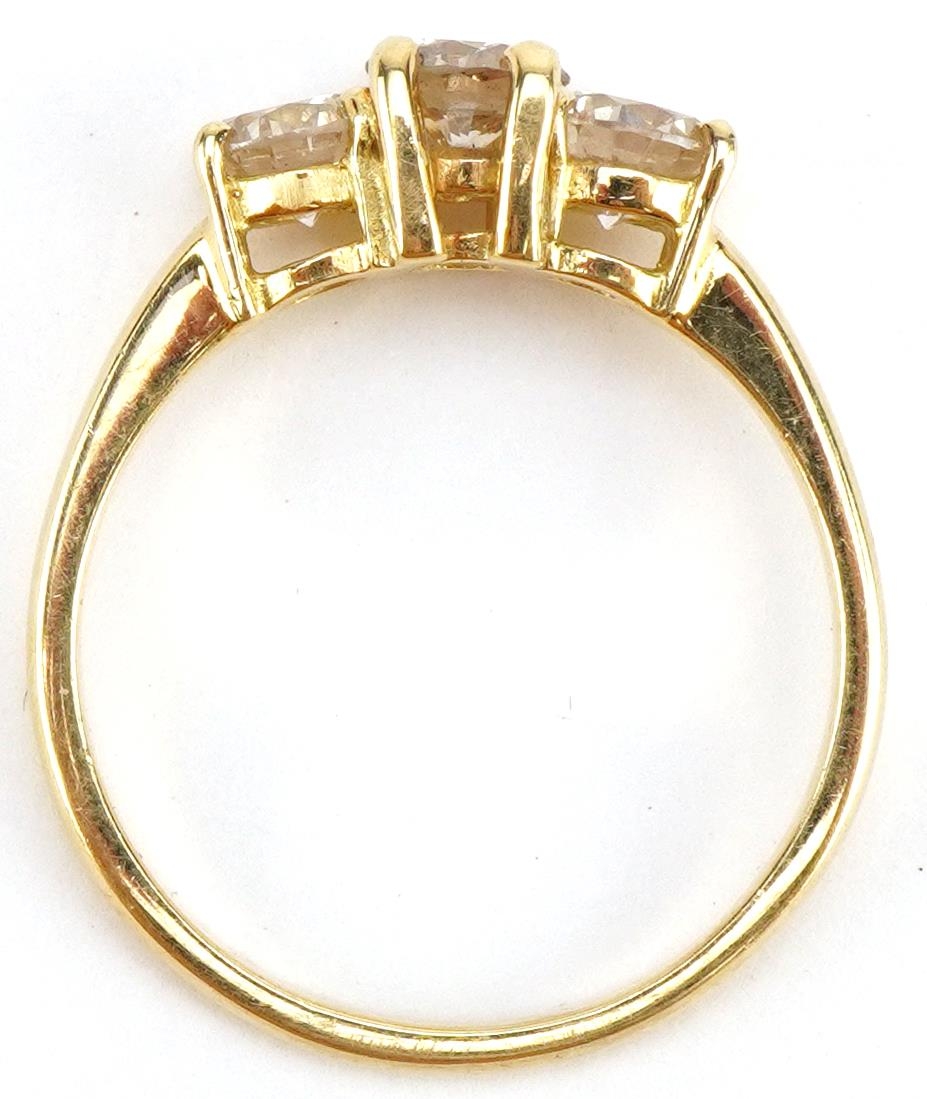 Unmarked gold diamond three stone ring, tests as 18ct gold, total diamond weight approximately 1. - Image 3 of 3