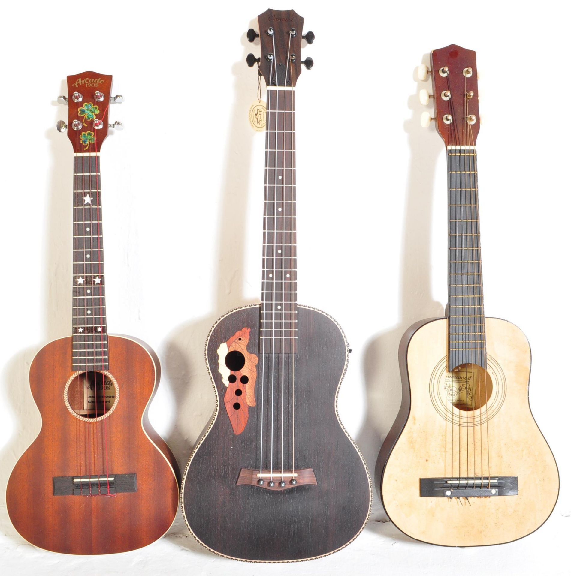 THREE VINTAGE & CONTEMPORARY UKULELES & GUITARS