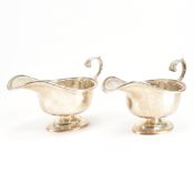 PAIR OF 1920S SILVER HALLMARKED GRAVY JUGS