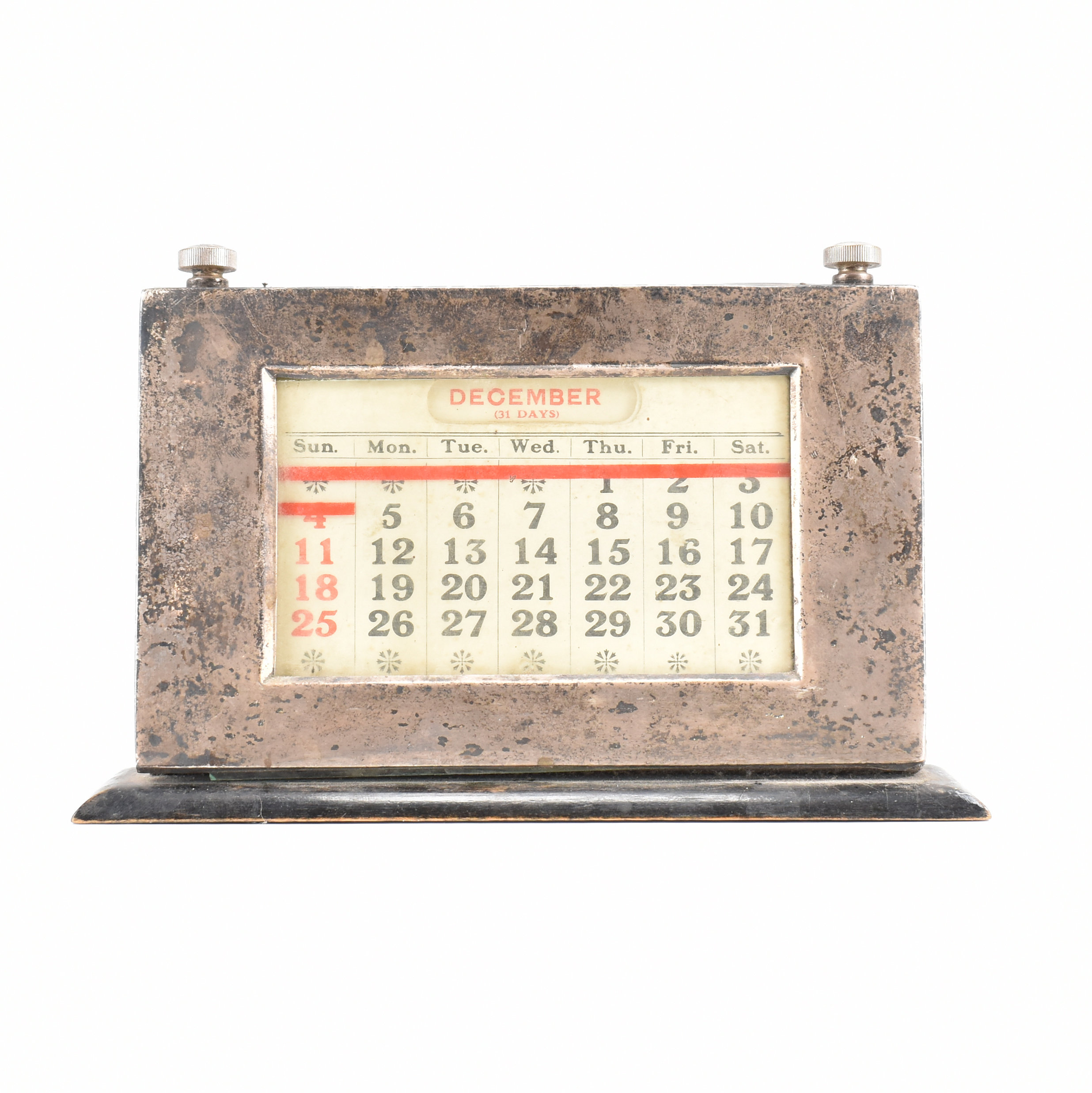 AN ART DECO SILVER AND WOOD DESK CALENDAR