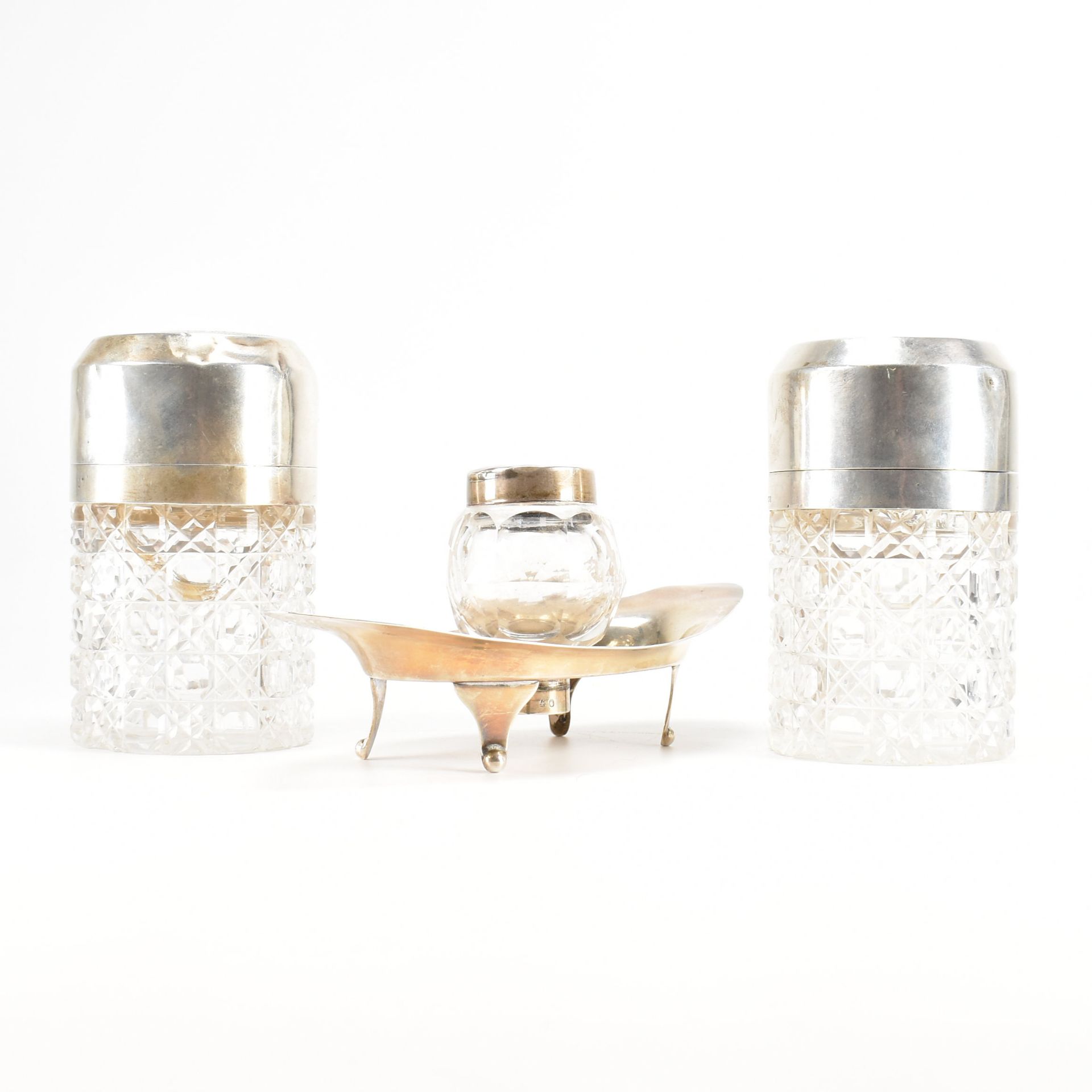 AN EDWARDIAN SILVER HALLMARKED INKWELL TOGETHER WITH TWO VICTORIAN CUT GLASS BOTTLES