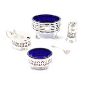 COLLECTION OF HALLMARKED SILVER BLUE GLASS LINED CONDIMENTS