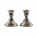 A PAIR OF SILVER HALLMARKED STUB CANDLESTICKS