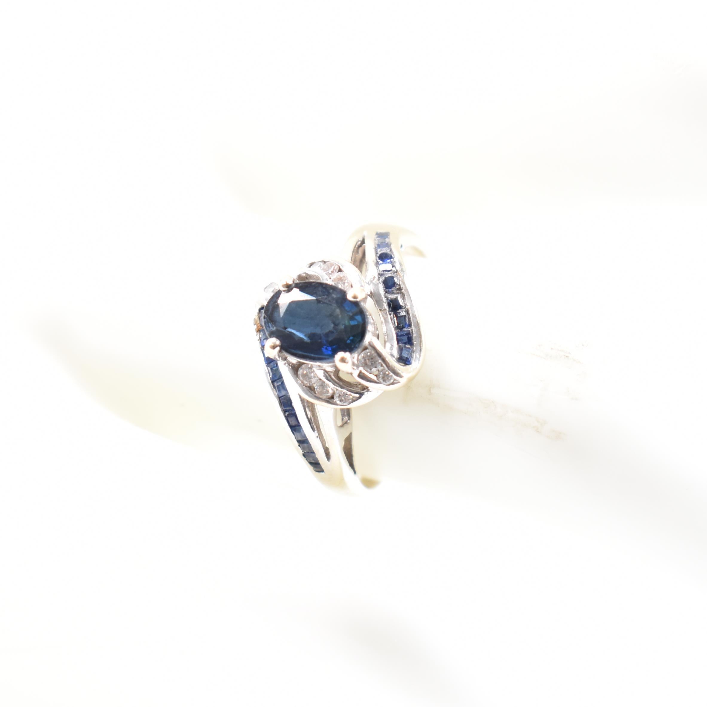 WHITE GOLD SAPPHIRE & DIAMOND CROSSOVER RING - Image 8 of 8