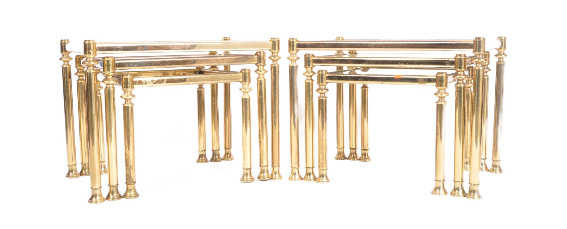PAIR OF 1980s BRASS AND SMOKED GLASS NESTING TABLES