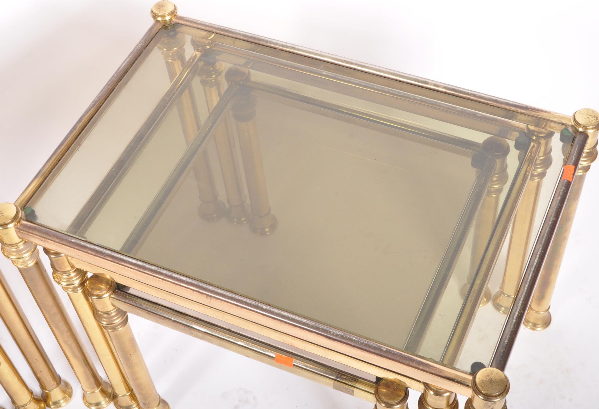PAIR OF 1980s BRASS AND SMOKED GLASS NESTING TABLES - Image 3 of 4