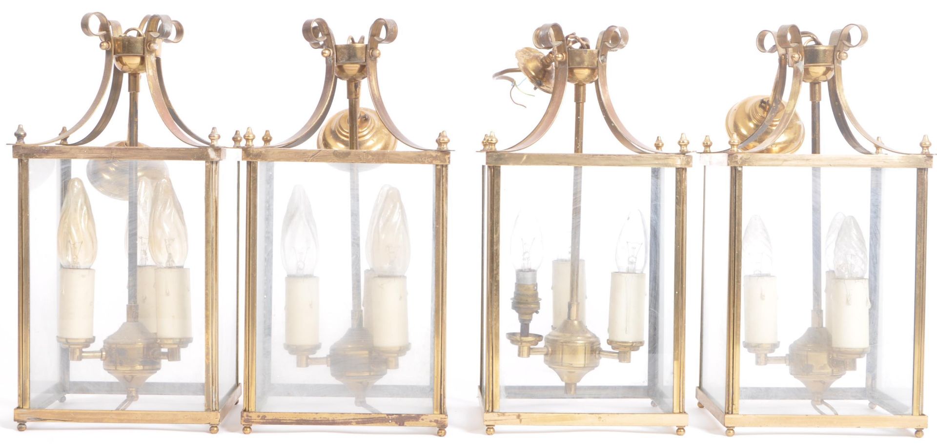 MATCHING SET OF FOUR GEORGIAN STYLE BRASS LANTERNS